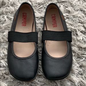 Black camper slip on shoes with elastic
